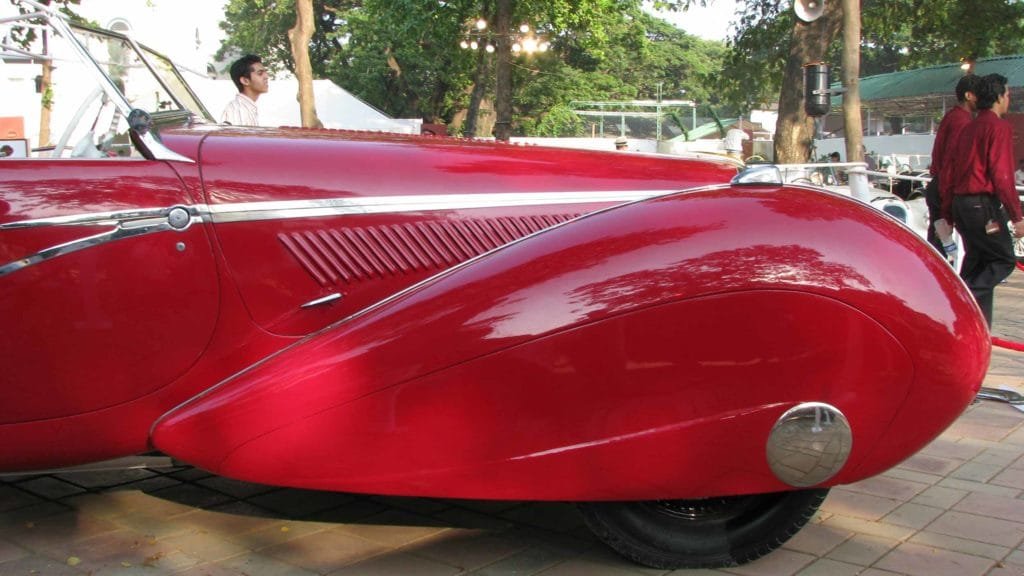 Closeup view of the speed line inspired bonnet air grille, concealed door handles and teardrop inspired fenders – a novelty, Photo Credit: Karl Bhote