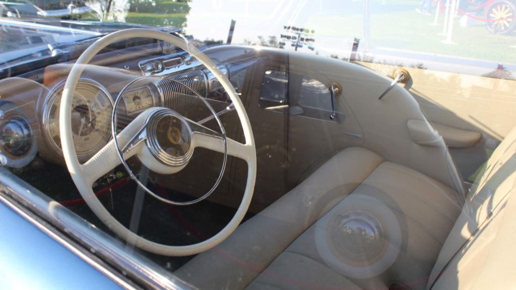 View of the dashboard, steering wheel and upholstery inside Lincoln Zephyr 1941, Photo Credit: Karl Bhote