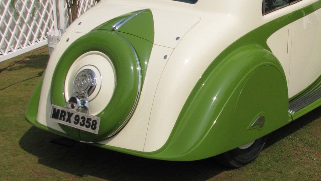 Closeup view of the rear wheel spats with teardrop motif and the rear fenders designed to enclose the wheels, Photo Credits: Karl Bhote